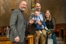 Elliot with his parents and Rev Fergus Cook