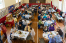 A busy hall - everyone enjoying good coffee, tea, cake and chat