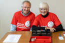 Jim Bishop and Frances Douglas collecting entry money at the door