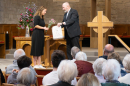 Rev Fergus Cook presents Matilda with gifts on the occasion of her joining the Church of Scotland